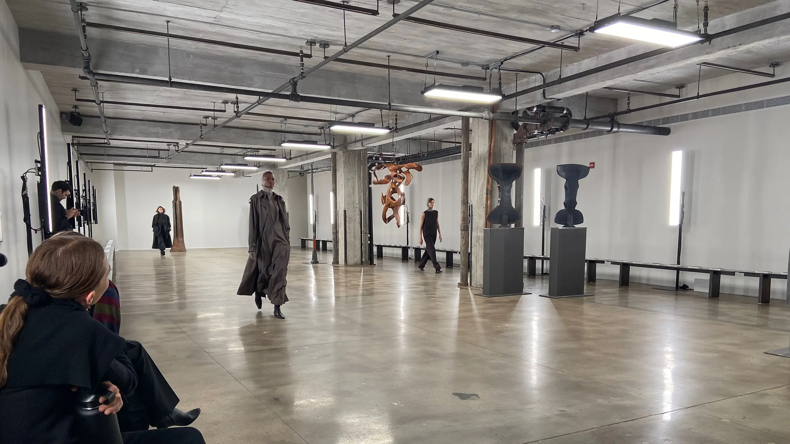 Ready-to-wear models walk runway in art gallery